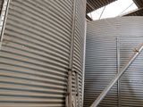 two large metal tanks that are next to each other