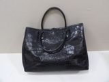 black leather handbag with croc embosishments on the front