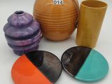 many different colored dishes and cups on the table