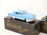 two toy cars that are on top of a box