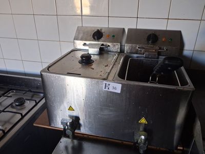 a picture of a kitchen with a stove and a sink