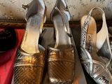 three pairs of shoes are sitting on a box on a table