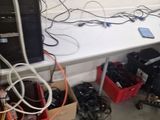 a white table with a bunch of electronics on it