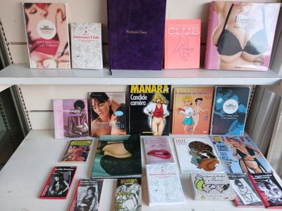 many books on a shelf in a room