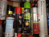 many different types of sprays and cans on the shelf