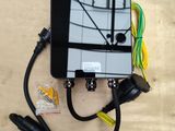 an overhead view of a cell phone connected to a charger
