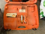 an orange case with batteries and batteries inside of it