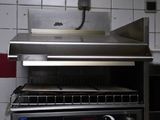 an image of a commercial kitchen with a stove and oven