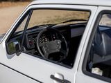 a small white car with a steering wheel and dashboard