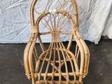 an image of a wicker chair sitting on top of a cement floor