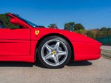 the red sports car is parked on the side of the road
