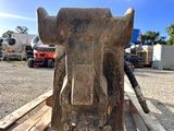 a close up of a bull head on a piece of wood