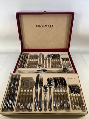 a box with silverware in it on a table