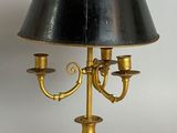 a lamp that has a black shade on top of it