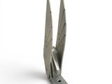 a metal sculpture of a pair of scissors on a white surface