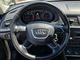 dashboard of a car with a steering wheel and dashboard gauges