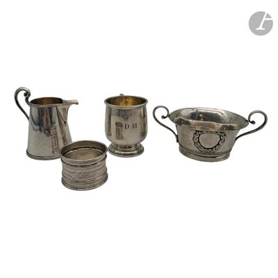 three pieces of silverware are sitting on a white surface