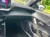a picture of a car dashboard with a tv in it