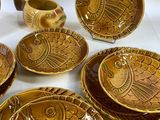 many plates and bowls that are sitting on a table