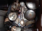 a box full of old silverware and other items
