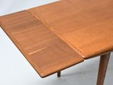 an image of a close up of a wooden table with a piece of paper on it