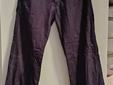 a purple pants hanging on a wall in a room