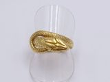 an image of a gold ring with a snake on it