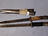 three knives that are sitting on a table