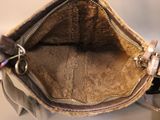 a purse that has a key in it on a table