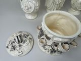 three vases and a coaster on the table