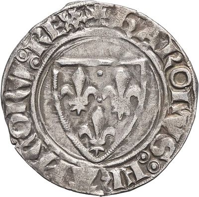 a close up of a coin with a coat of arms on it