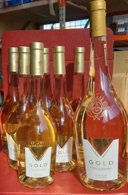 several bottles of wine are sitting on a shelf in a store