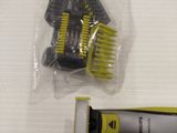 a yellow and black razor and a yellow and black comb