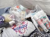 many items that are in a bag on the floor