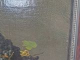 a picture of a painting of grapes and a bird in a basket
