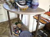 a table with plates and bowls on it in the kitchen