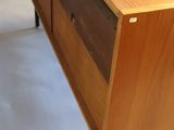 an image of a wooden dresser in a room
