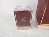 a small box with a bow on it next to a small box with a bow on it