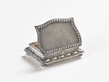 silver plated trinket on stand on white background