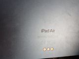 an apple ipad air sitting on top of a desk next to a keyboard