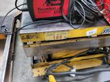 a picture of a welding machine sitting on top of a pallet