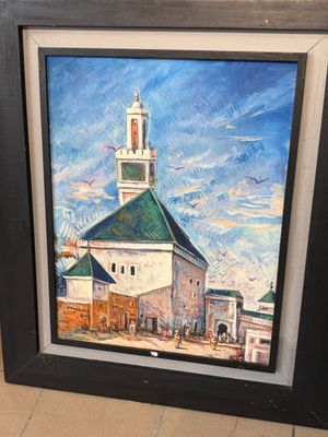 tableau représentant une église avec un clocher, dans un cadre noir