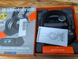 the box is open on the table with a pair of headphones in it