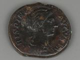 une vieille pièce de bronze à l'effigie d'un homme