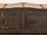 a wooden chest with two doors open on a tiled floor