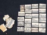 a lot of old postcards on a black cloth
