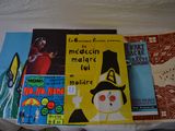 many books that are laying on a bed together