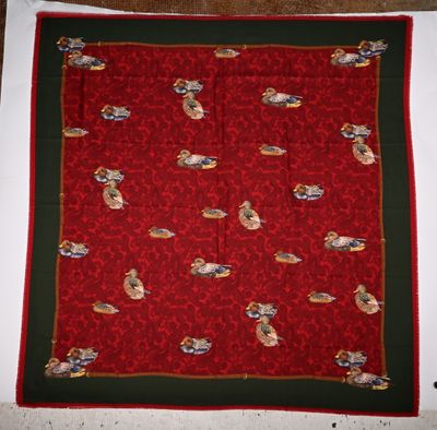 an image of a red and green table cloth with cats on it
