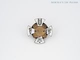 an image of a pin with a teddy bear on it