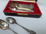 two spoons and two spoons sitting in a box